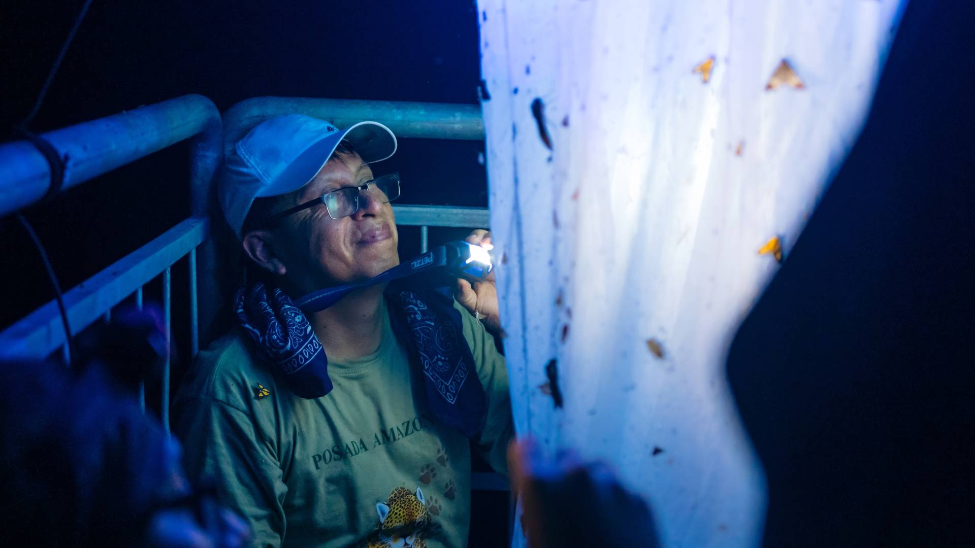 Juan Grados with the LepiLED light trap by Carlos Gonzalez